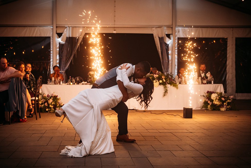 bride and groom first dance with sparklers